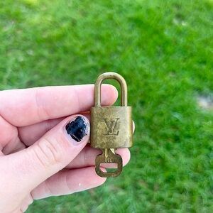 Louis Vuitton authentic gold lock and key number 318